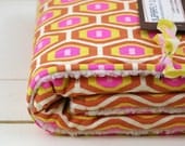 baby blanket, retro honeycomb in pinks and browns, parent-friendly.