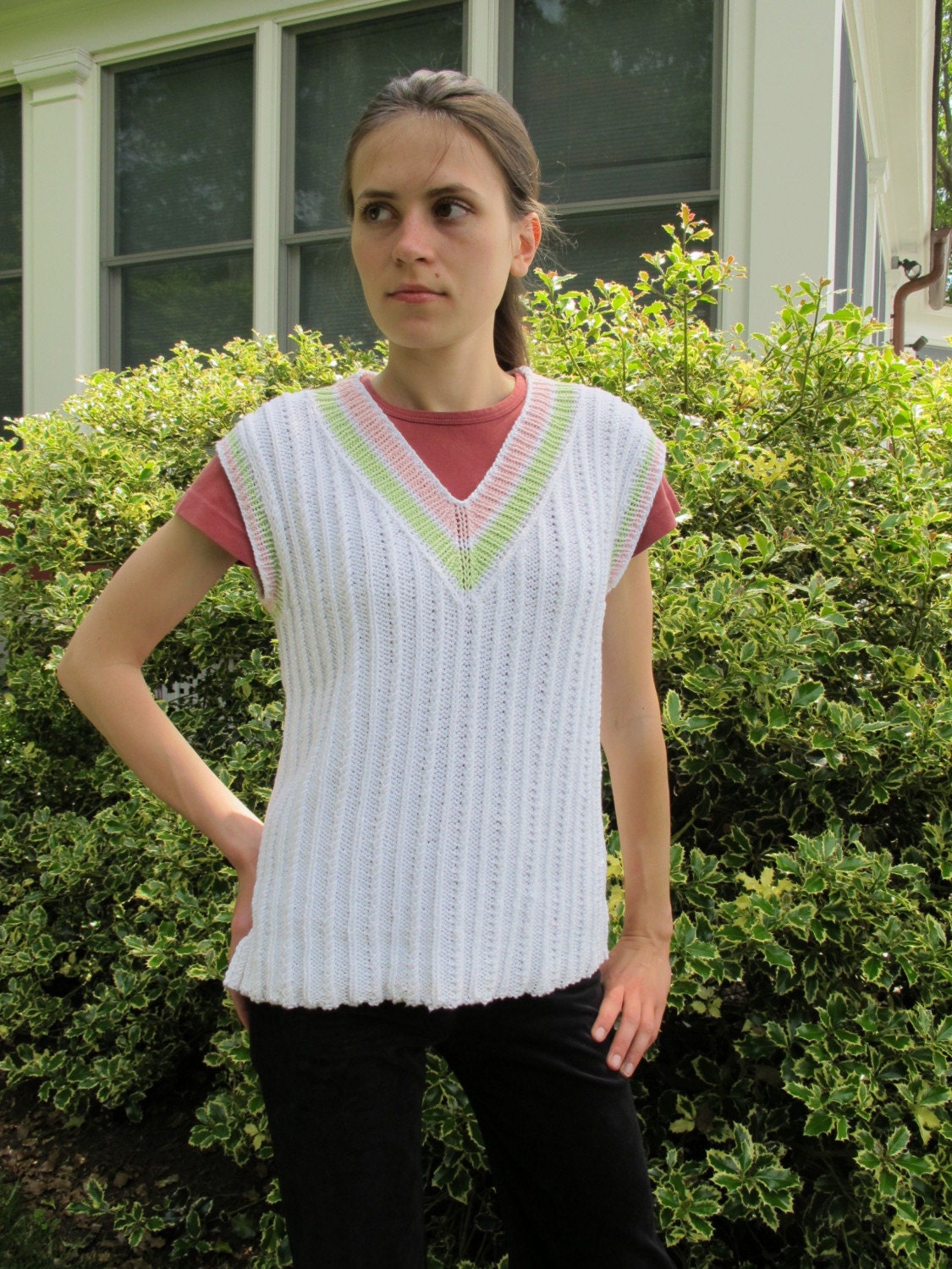 Tunic Tennis Vest, twisted stitches replace traditional cables in this sweater vest. PDF knitting pattern