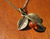 Brass and orange glass bead berry branch necklace