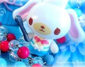 Sweet sugarbunnies chef with blue apron and pink bow necklace on pink and blue beaded chain