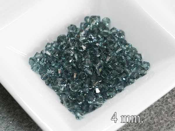 100 pcs. Swarovski Crystal Bicone Indian Sapphire 4 mm.