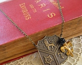 Herald . Brass Crest, Fleur de Lis, and Black Rose