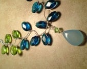 Wonderful silver vine necklace with sky blue chalcedony