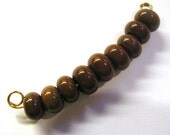 Reddish Brown Small Spacers - 9 Lampwork Beads