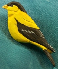 Wood Carving of an American Goldfinch Tupelo Pin