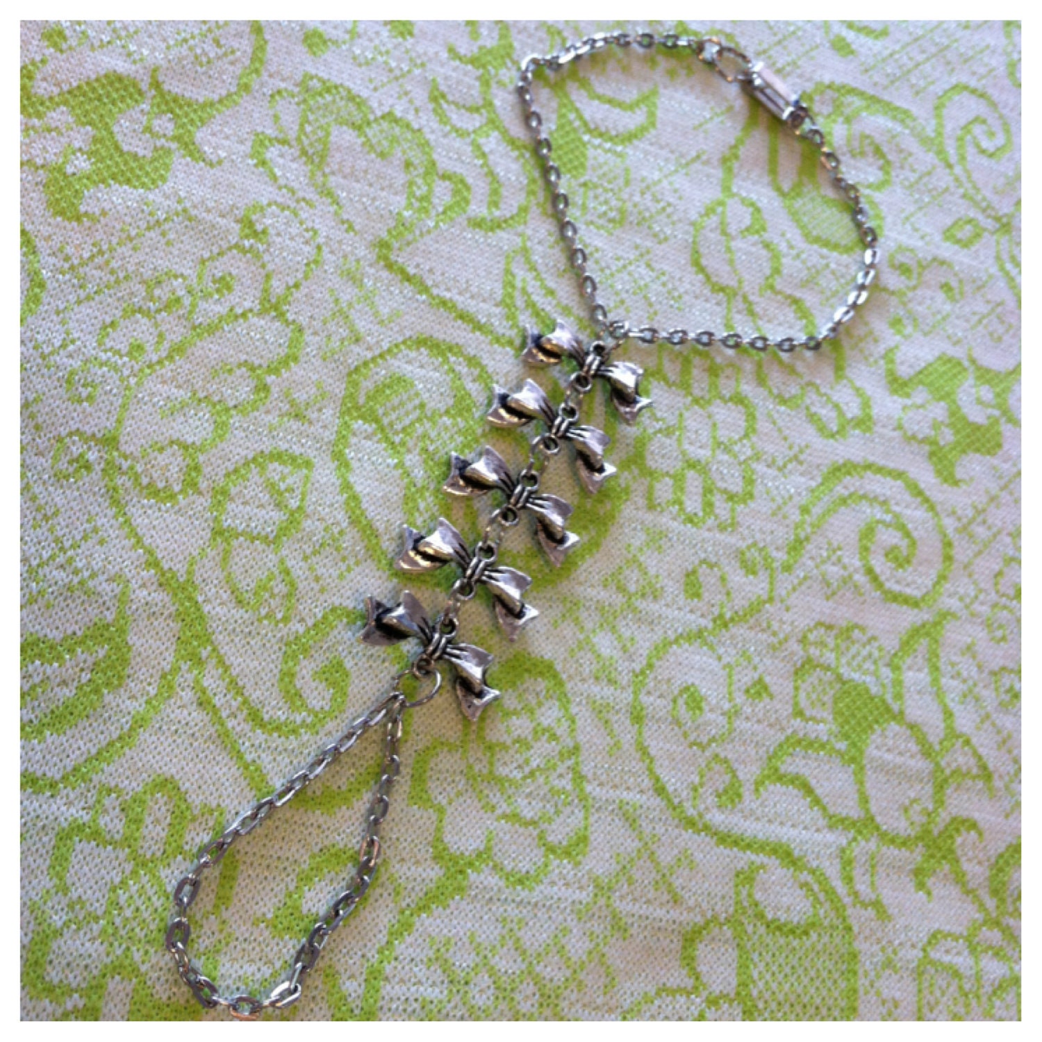 silver bow slave bracelet chain links ring