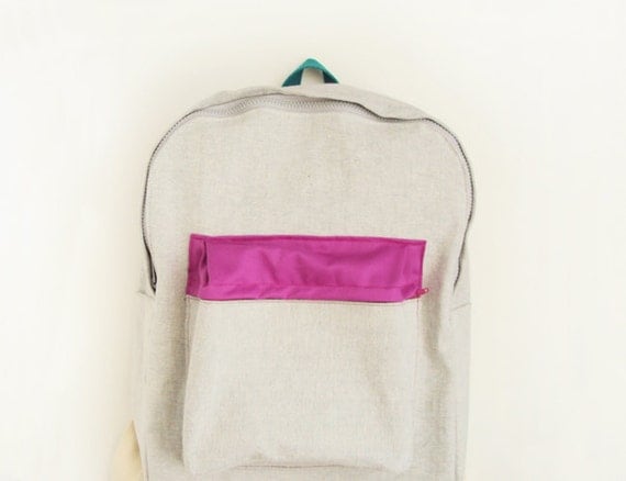 light grey denim backpack with magenta pouch