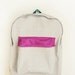 light grey denim backpack with magenta pouch
