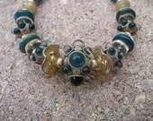 Dark Blue and Cream Lampwork Bracelet with 14k GF Beads, Mother of Pearl, Citrine and Montana Blue Swarovski