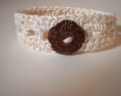 Wristlet no. 13, cream cotton with coconut flower button