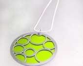 Round Pendant with Large Lime Bubbles on the front and Black on the back