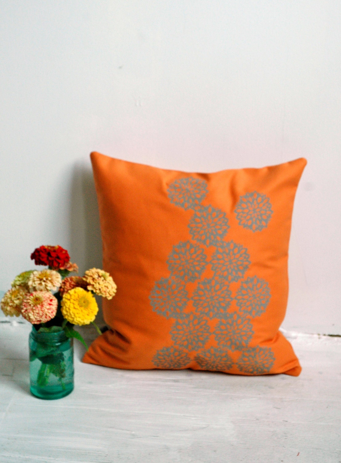 Orange Pillow with Astera Print