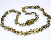Green, greenish rounded beads amber teething necklace for your baby and FREE GIFT.