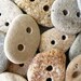 5 BEACH STONE BUTTONS...5 sweet hand drilled beach stones
