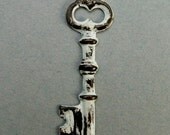 Aged White Brass Skeleton Key Charm