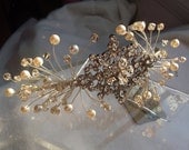 New handmade tiara using light cream swarovski pearls, golden swarovski crystals and a vintage look diamante brooch.