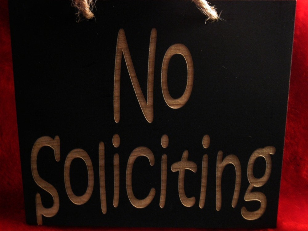 No soliciting  wooden sign
