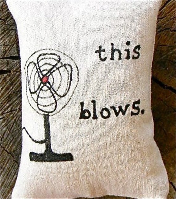 This Blows pillow door hanging