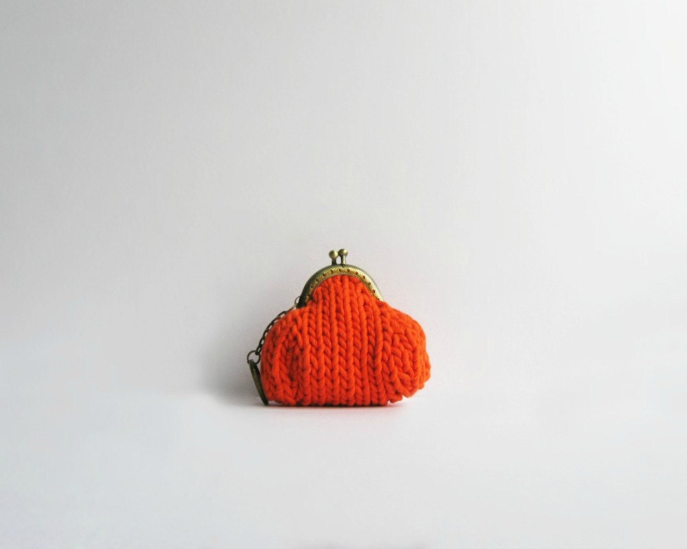 small purse knitted in orange cotton yarn