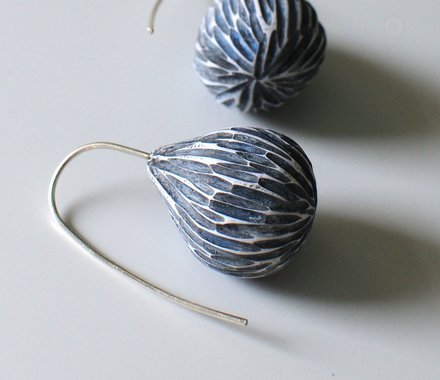 Carved pods in pale blue