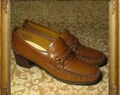 60s 70s brown leather moccasin loafers. wood heels. braid and stich details. sz 8. eur sz 38.5.