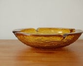 large mid century ANCHOR HOCKING heavy glass ashtray. Soreno pattern. Honey gold color.