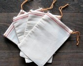100 6 x 8 Cotton Muslin Red Hem and Orange Drawstring Bags