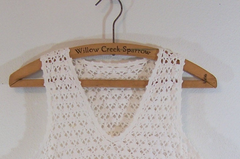 White Crocheted Sleeveless Sweater .