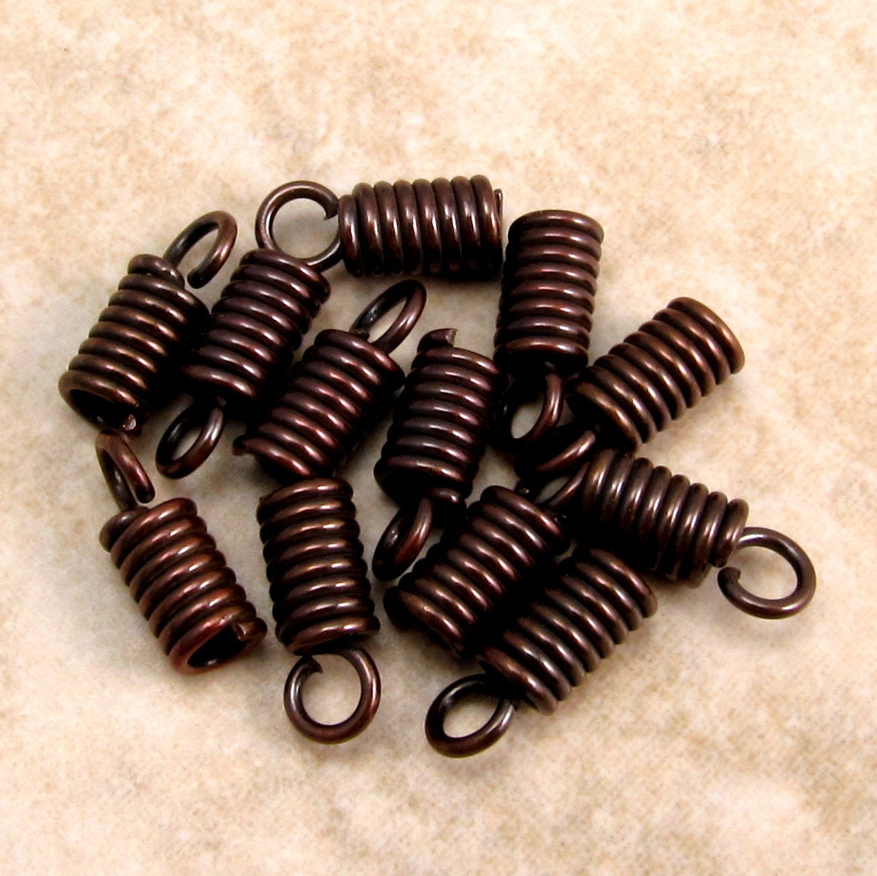 Mykonos Spring Cord End 2 MM Bronze, 12 Pieces M83