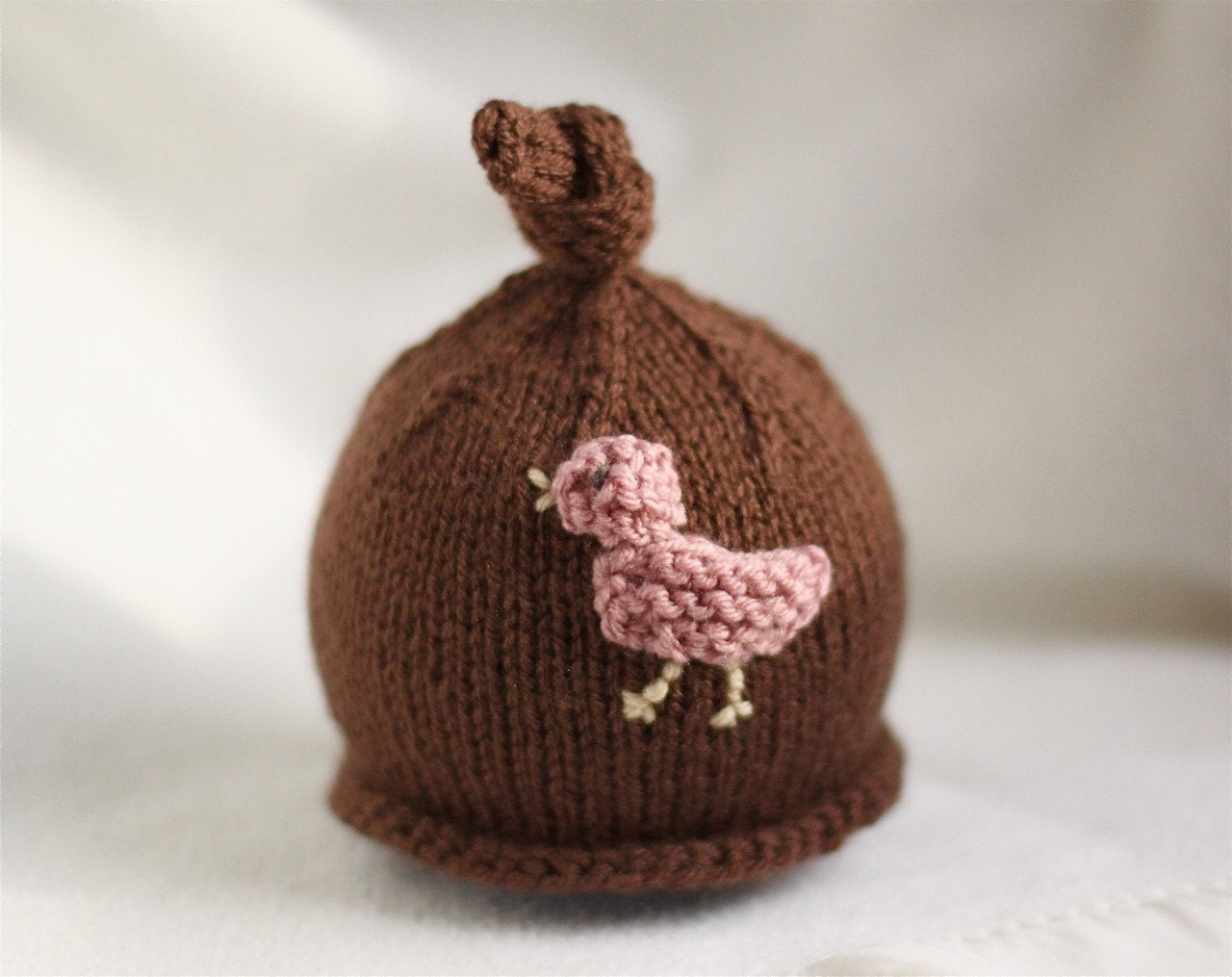 Baby girl or boy knit hat with bird applique.  Sizes newborn to big kid available.