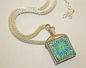 Reversible caned polymer clay pendant
