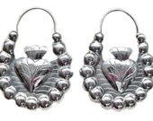 Frida Style silver hoops with a milagro heart in the middle