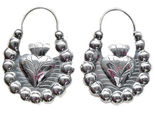 Frida Style silver hoops with a milagro heart in the middle