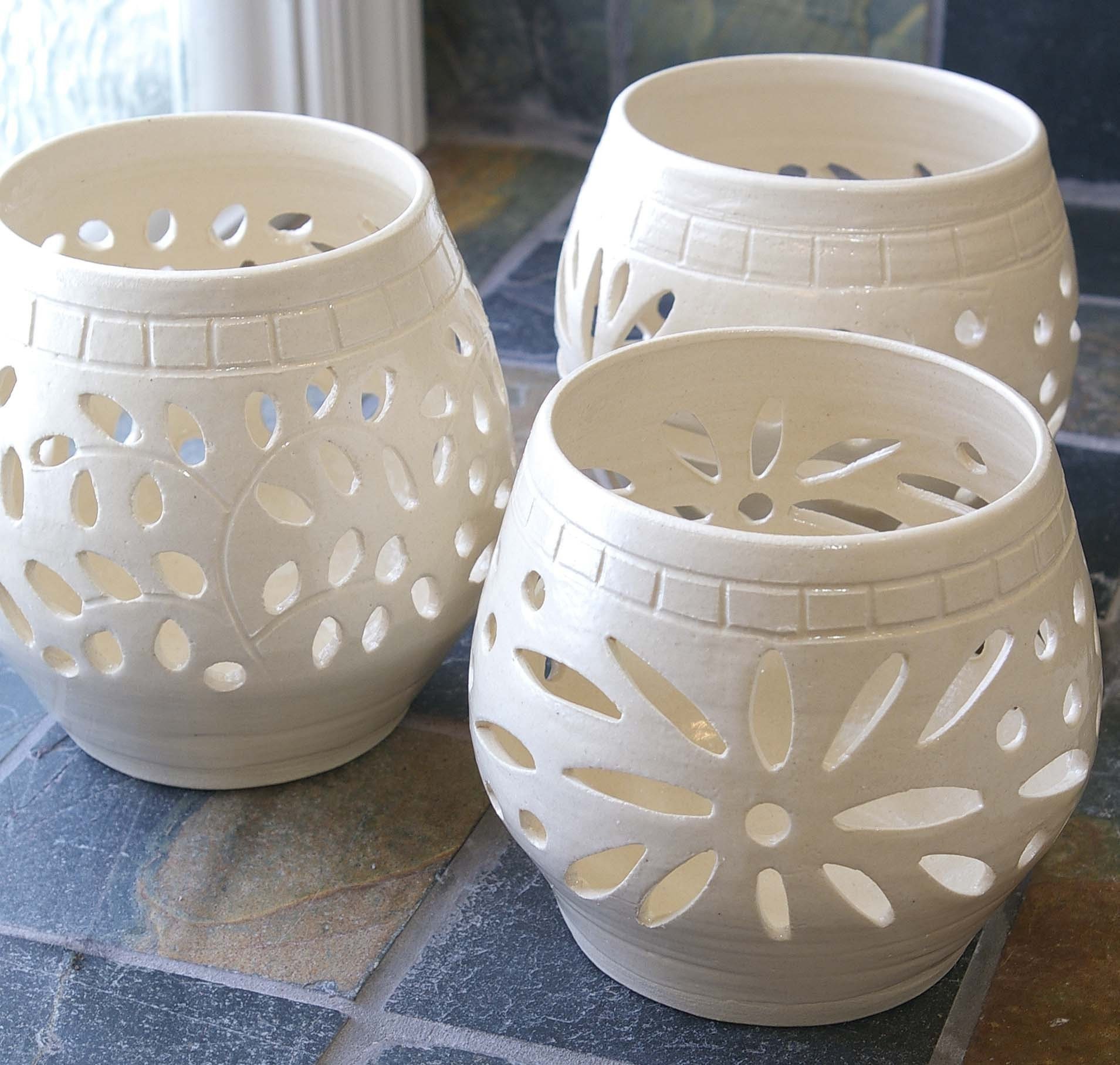 pretty for candle holders also more firesafe! haha Pottery candle