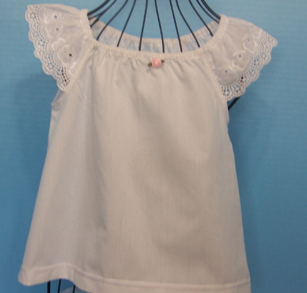 White blouse-dress -pinafore with eyelet sleeves and pink rose