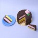 Dollhouse miniature food Neopolitan chocolate cake with slices cut