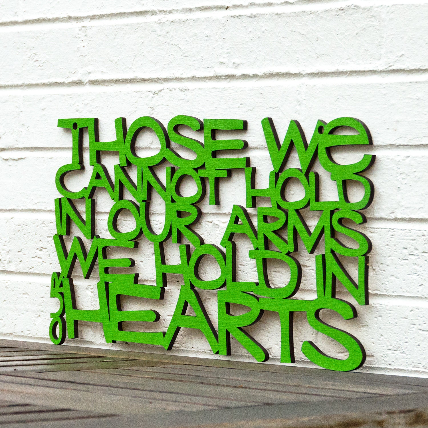 Those we cannot hold in our arms, we hold in our hearts