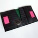 Recycled bike inner tube bifold wallet with neon pink velcro closure and dark green linen
