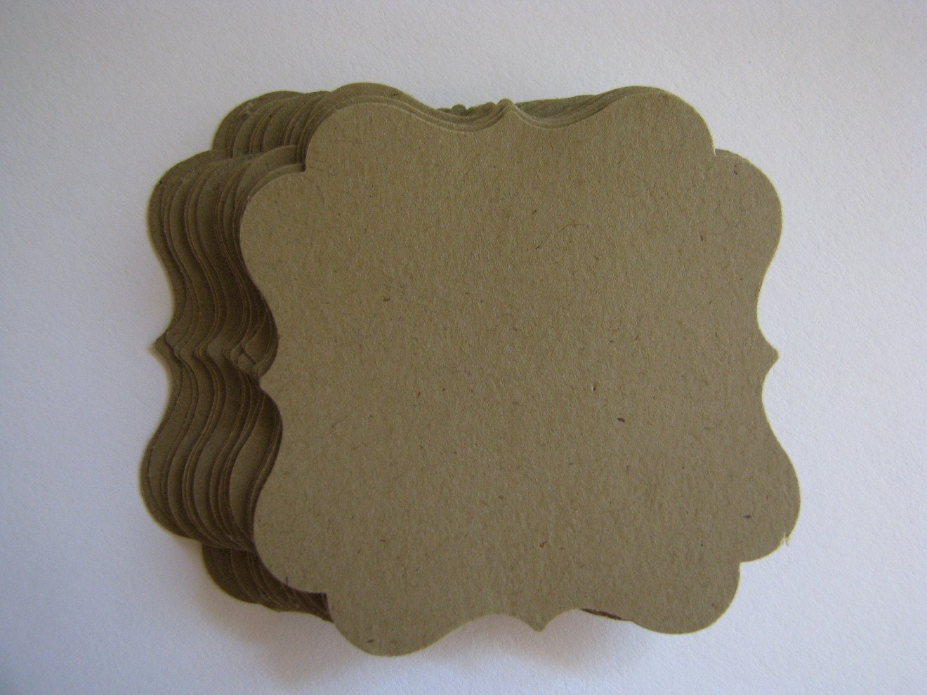 funky brown paper swirly square cutouts