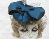 Cute Cocktail Fascinator Tilt Womens  Hat in a Sexy Teal Taffeta with French Netting
