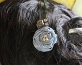 Blue Shimmer rosette hairclip with peacock side feathers, jewel and freshwater pearl center