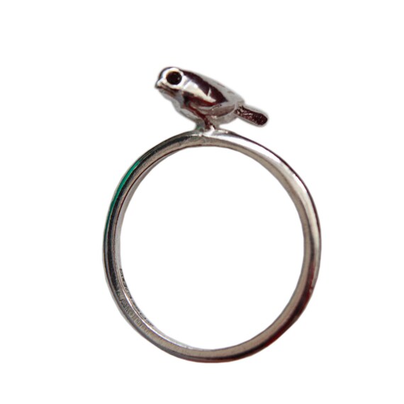 Tiny Bird. silver ring set with black diamond eyes.