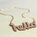 Hello Wooden Necklace. Laser cut in eco friendly birch wood. Gold or silver plated chain.