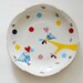 Super festive serving set of one very large and four smaller (cake/breakfast) plates