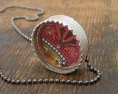 Puzzle Pod necklace-pendant game.