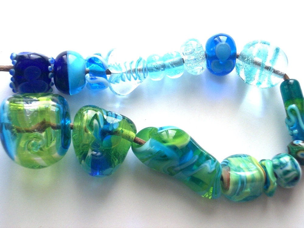 A set of 17 aqua and green glass beads, lampwork hand made by YasminSivan