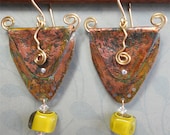 Alika's Shield.....folded copper triangles with brass spiral and glass bead