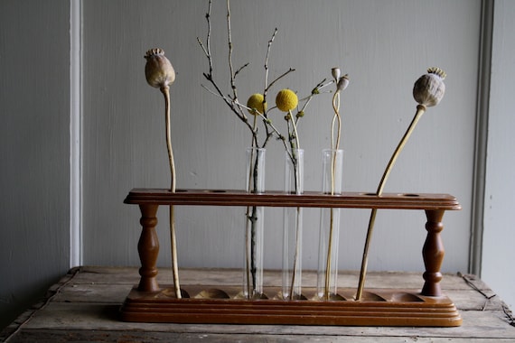 vintage wooden rack with test tubes