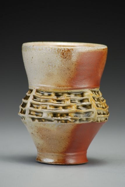 Cup, ridge textures, earth tones, wood and soda fired stoneware