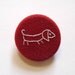 Red Sausage Dog Brooch. hand embroidered in white pin badge on organic cotton fabric